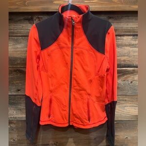 Rare Lululemon jacket, size 12, in a dark grey and orange color!